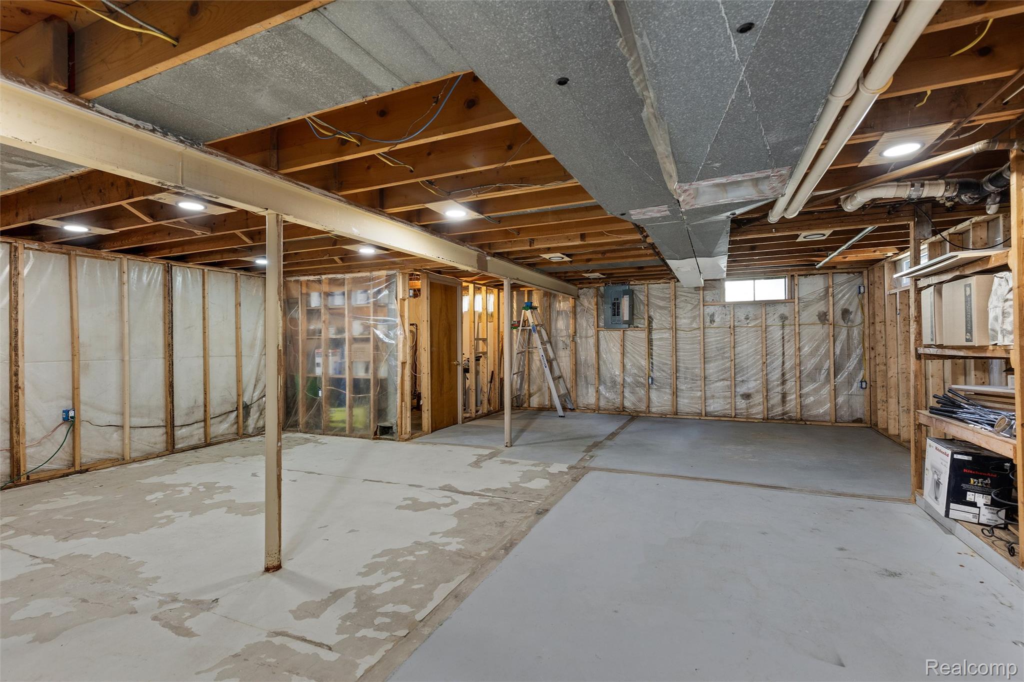 4497 Reid Road Swartz Creek, MI 48473 - Photo 21 of 31 Unfinished basement with exposed wood framing, concrete flooring, and visible ductwork