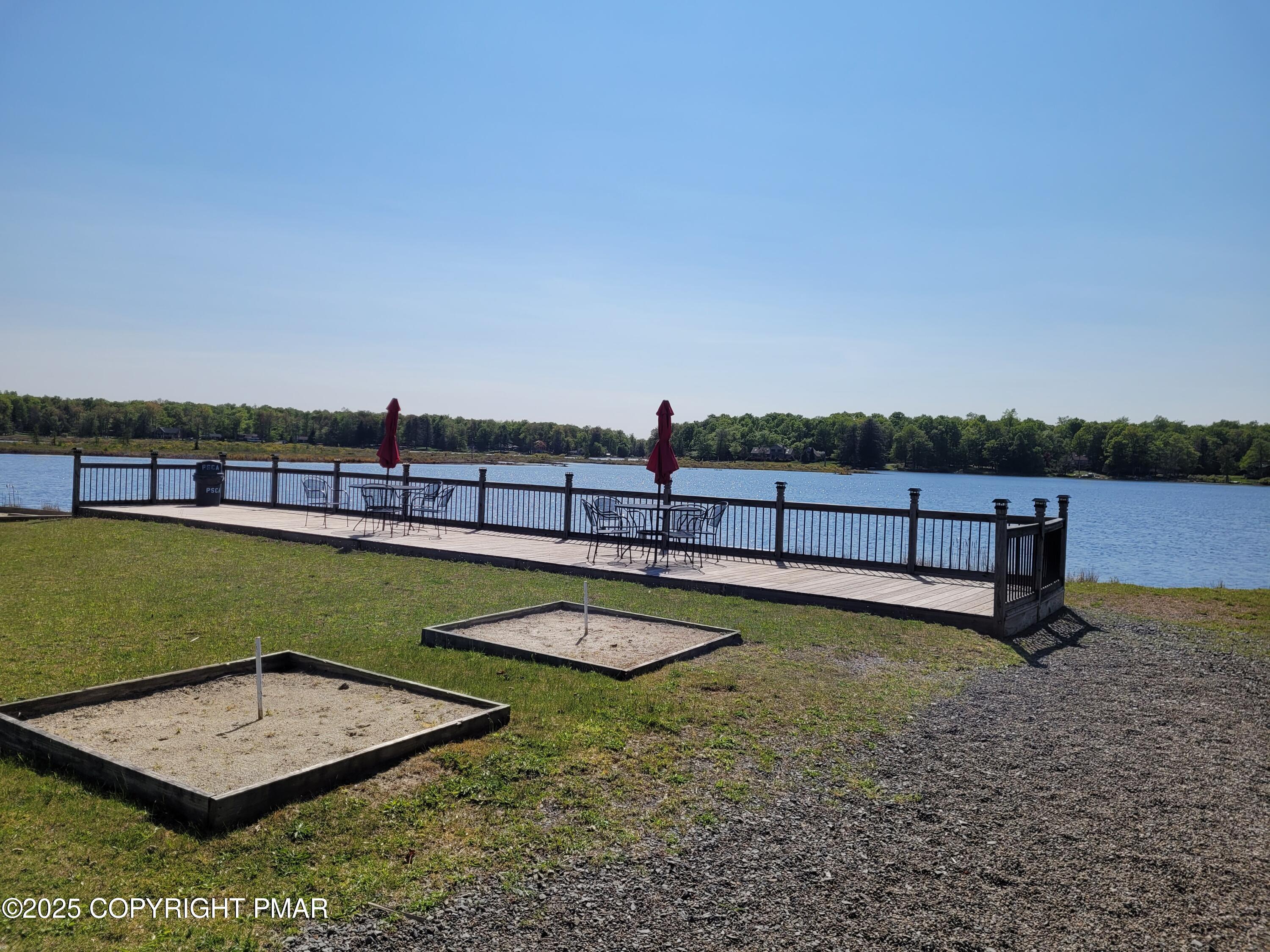51 Middle Ridge Drive Newfoundland, PA 18445 - Photo 12 of 33 a view of a swimming pool with a chair and trees
