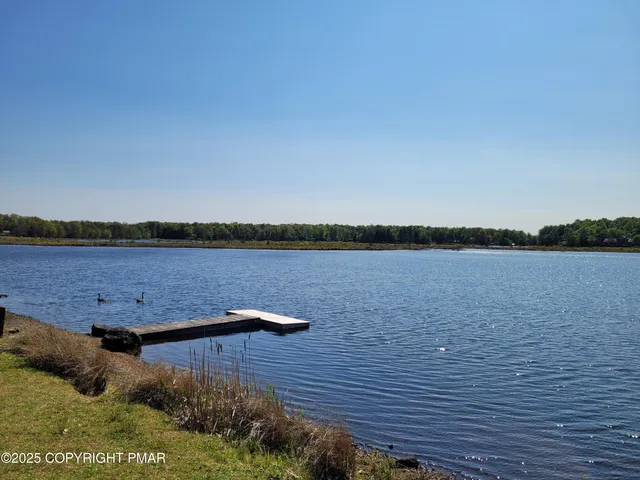 a view of lake with outdoor space