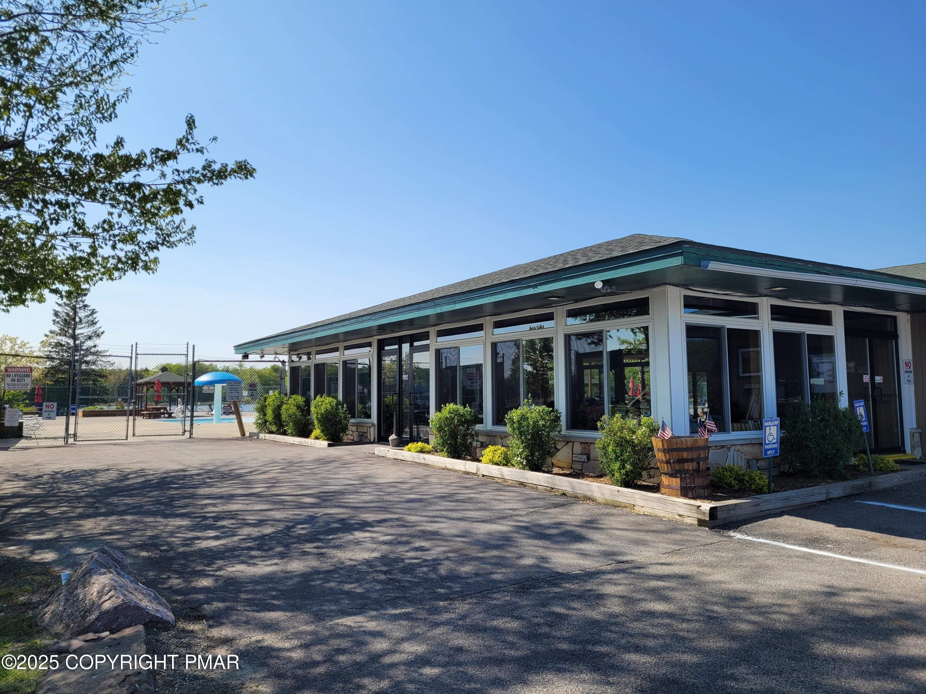 51 Middle Ridge Drive Newfoundland, PA 18445 - Photo 6 of 33 a front view of a house with a garden