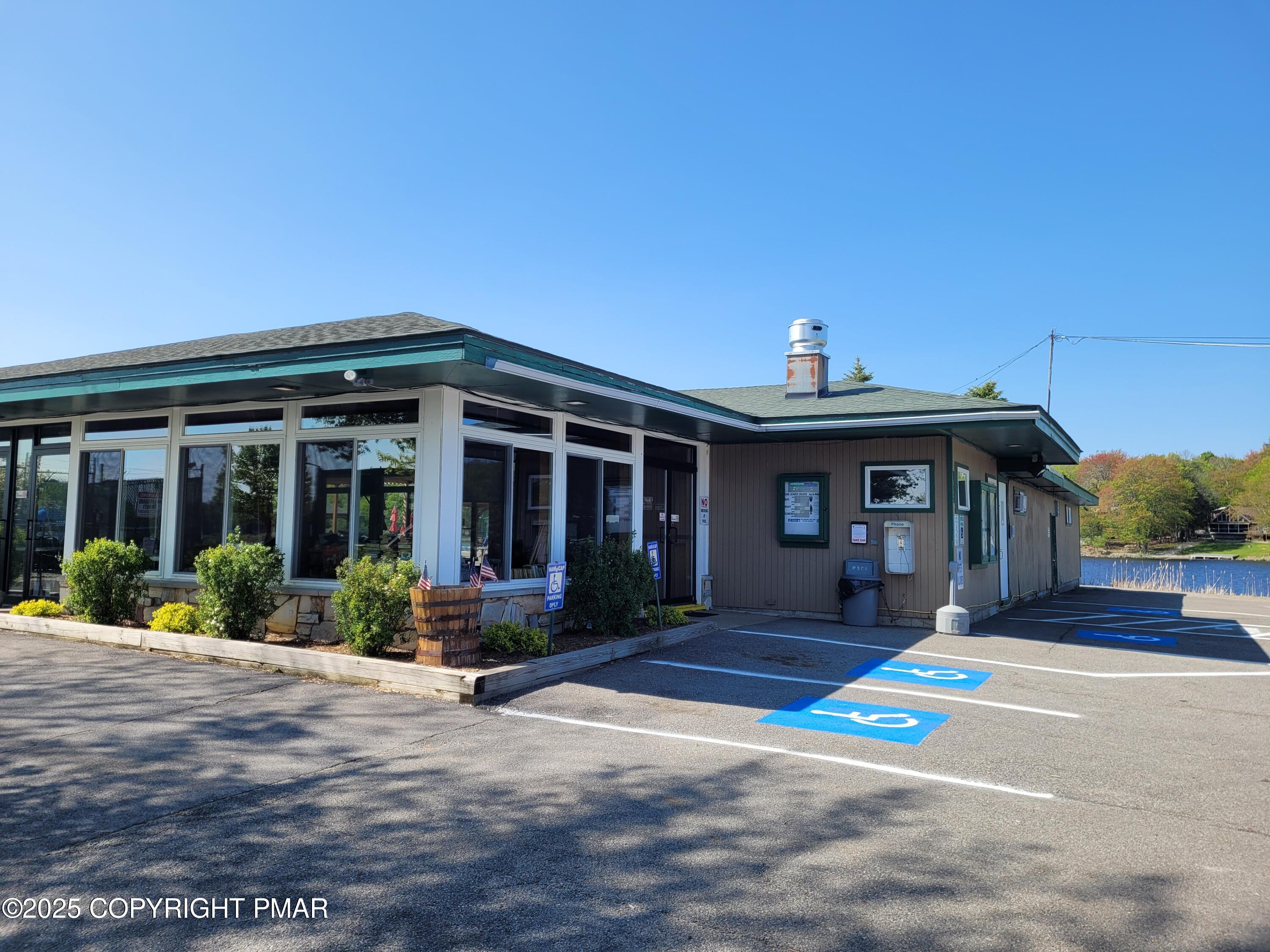51 Middle Ridge Drive Newfoundland, PA 18445 - Photo 7 of 33 a front view of a house with a yard