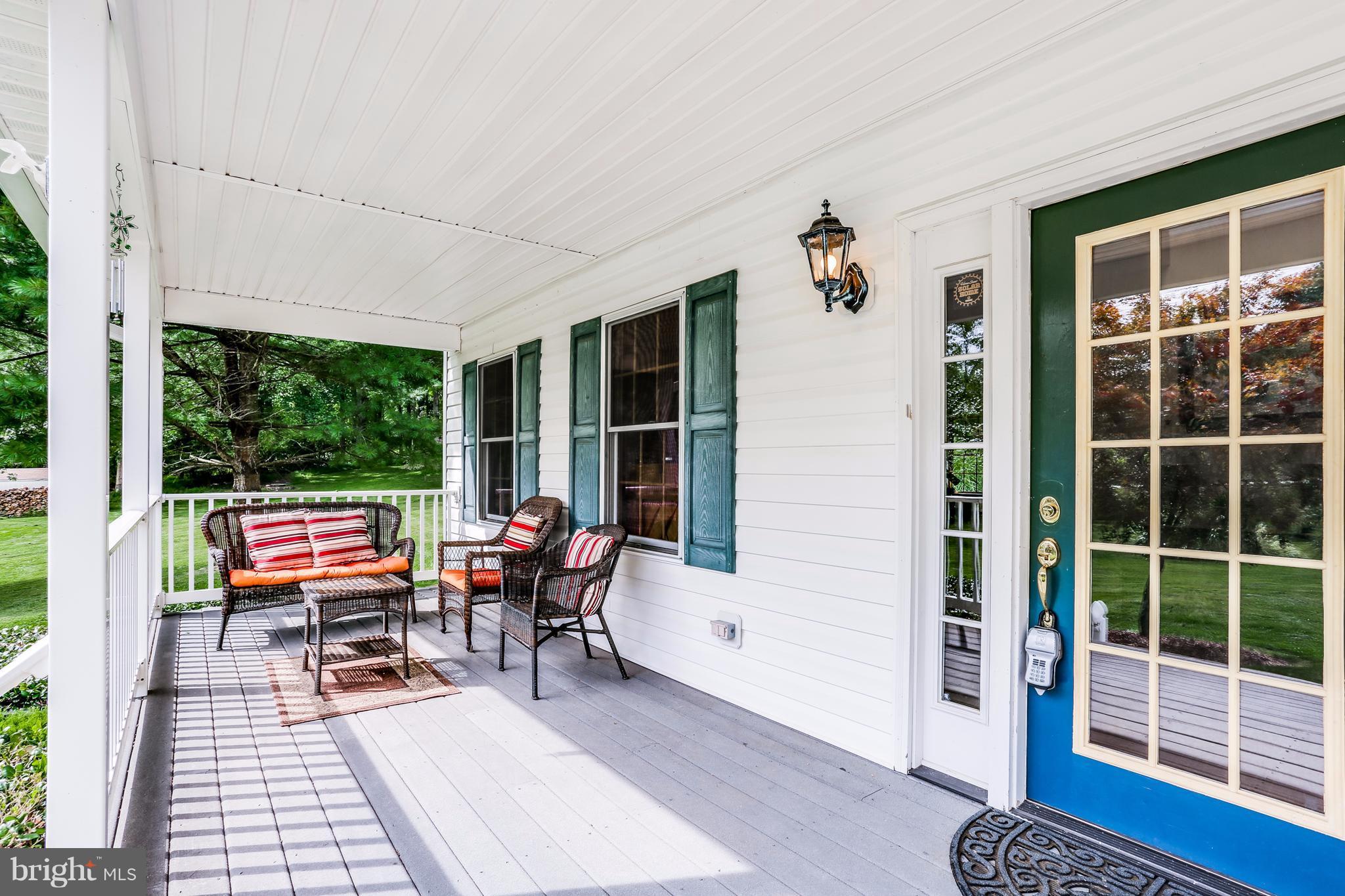 11946 Frederick Road Ellicott City, MD 21042 - Photo 3 of 30 Spacious front porch w/maintenance free trex deck