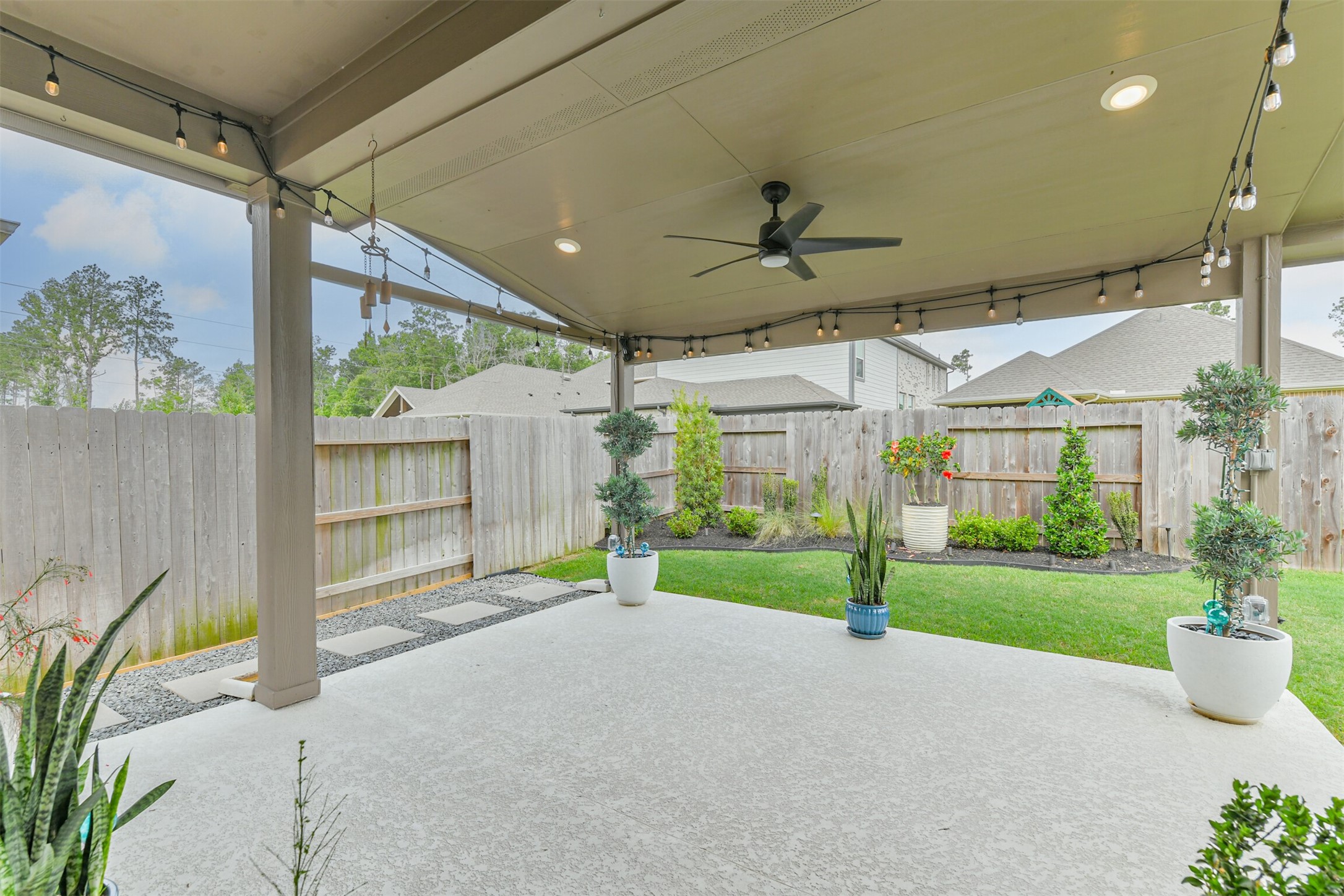 15611 Rising Wren Court Conroe, TX 77302 - Photo 21 of 38 a view of a porch and garden