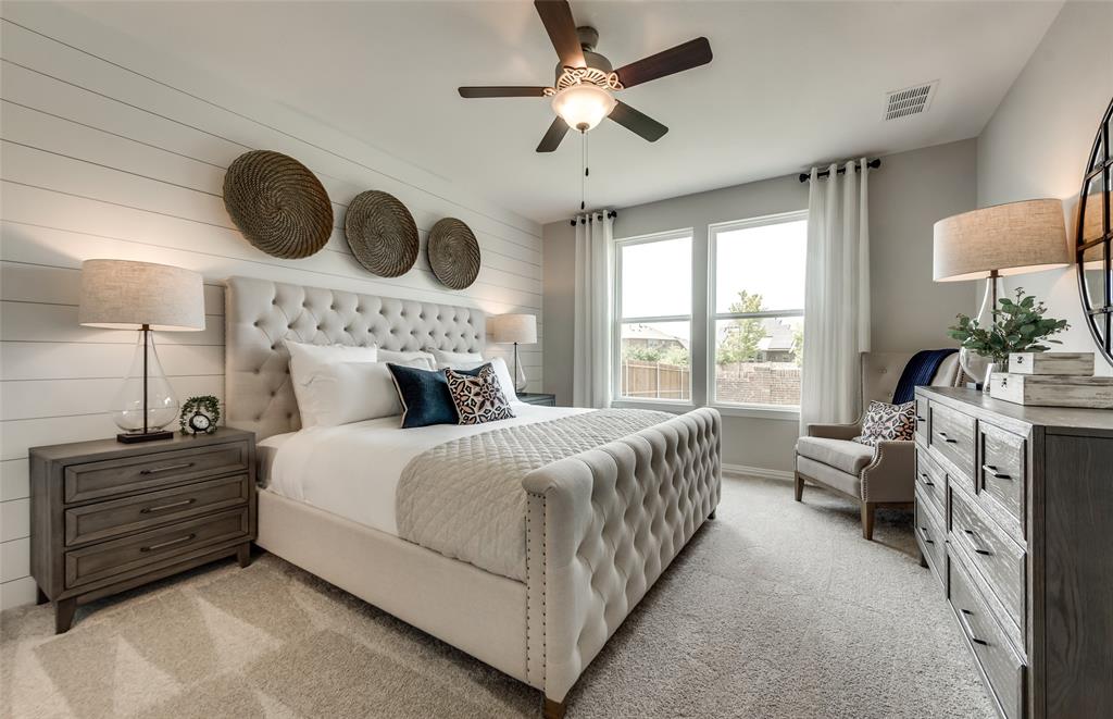 5942 Hodgkin Avenue Pilot Point, TX 76258 - Photo 14 of 20 a bedroom with a bed chandelier and a window