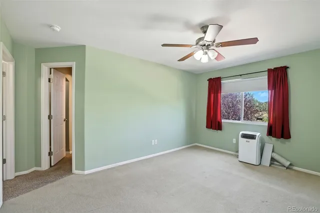 a bathroom with a granite countertop tub sink and mirror