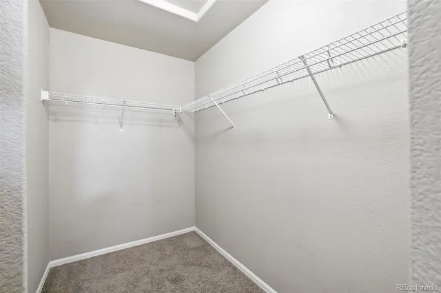 a view of a backyard with wooden fence