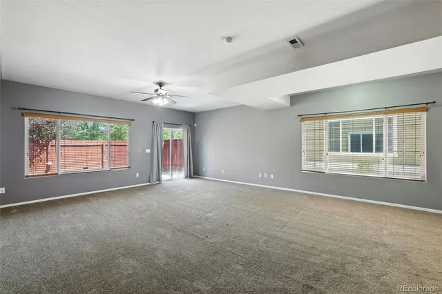 a kitchen with granite countertop cabinets stainless steel appliances and a sink