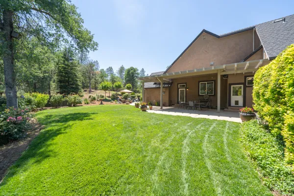 a view of backyard with green space