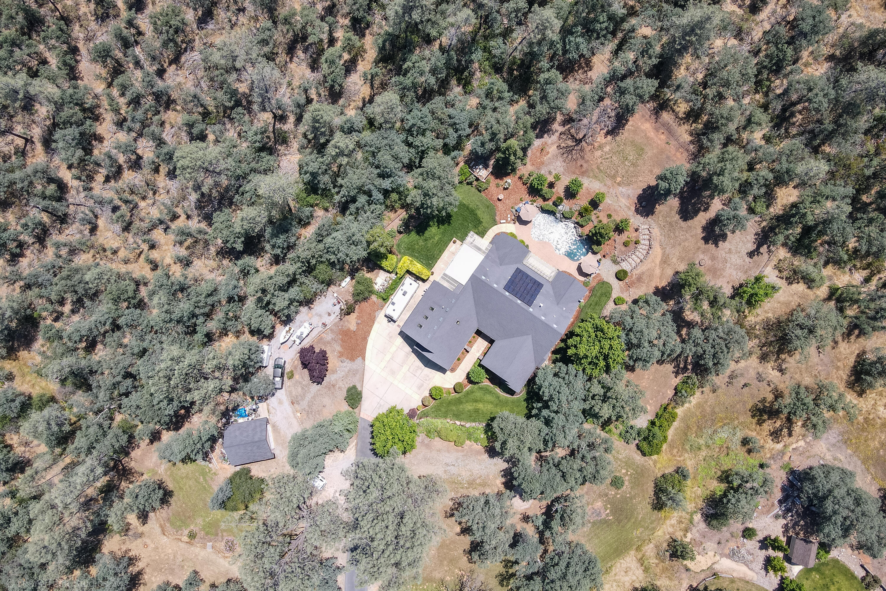 9109 Simmons Road Redding, CA 96001 - Photo 51 of 52 an aerial view of a house with a yard