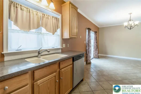 a view of a kitchen with a refrigerator cabinets and a wooden floor