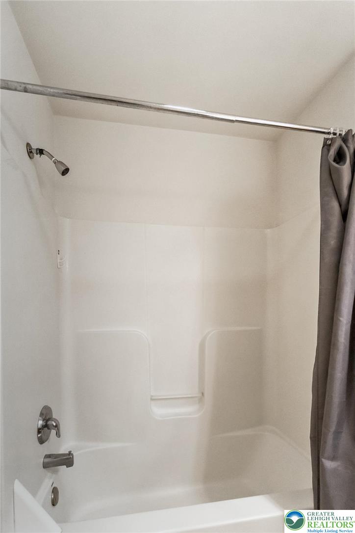 537 Kemmerer Lane Allentown, PA 18104 - Photo 29 of 39 a bathroom with a shower and a bath tub