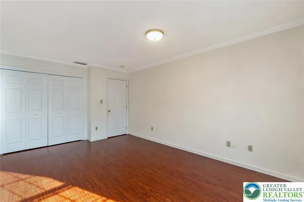 a view of a hallway with entryway door