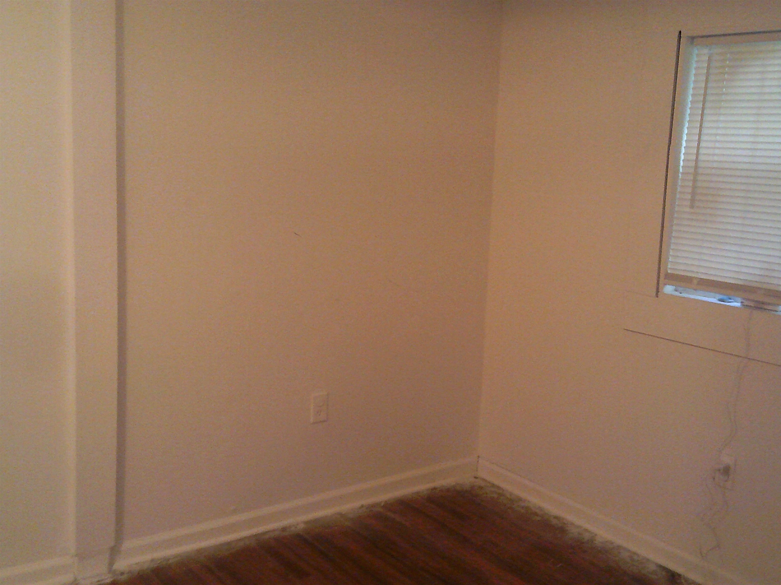 783 Nonconnah Road Memphis, TN 38109 - Photo 8 of 11 a view of a small space with wooden floor and a window