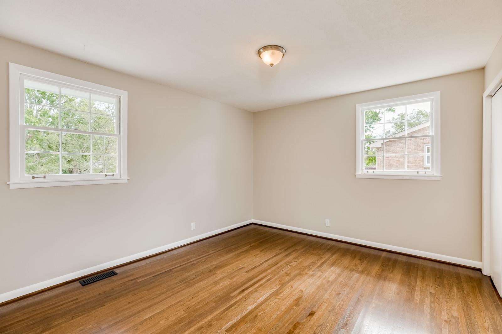 520 Rural Hill Road Nashville, TN 37217 - Photo 14 of 26 an empty room with wooden floor and windows