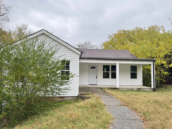 front view of a house with a yard