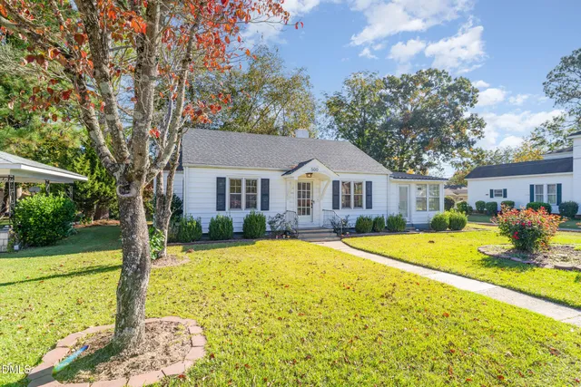 a front view of a house with a yard