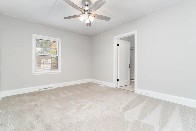 a bathroom with a toilet sink and vanity