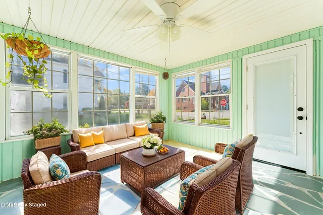 a living room with furniture and a window