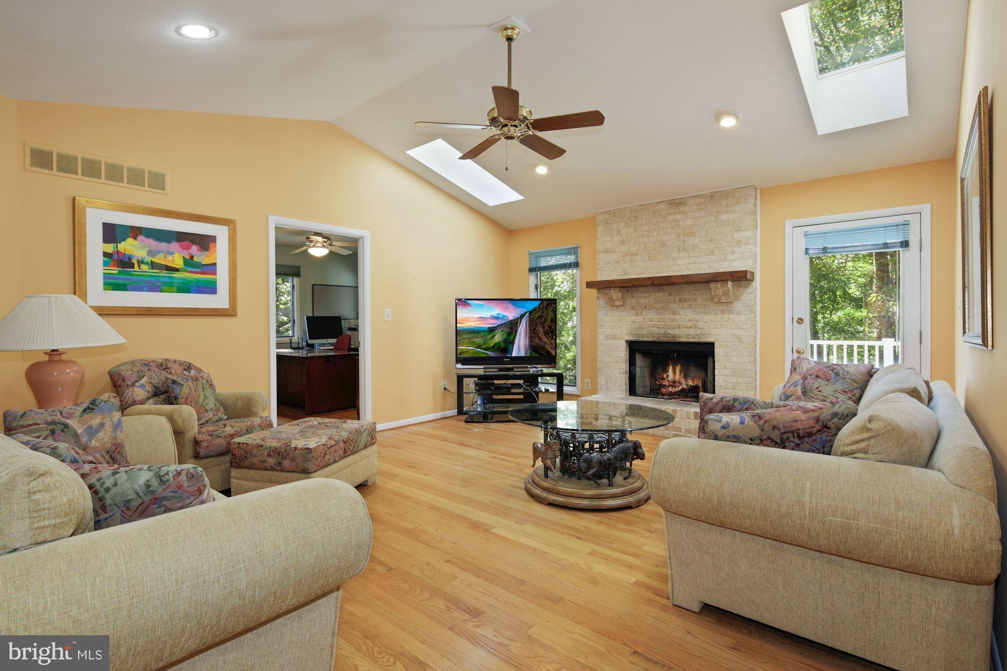 Vaulted ceilings and fireplace in Family Room