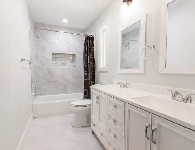 a bathroom with a sink a toilet and a bathtub