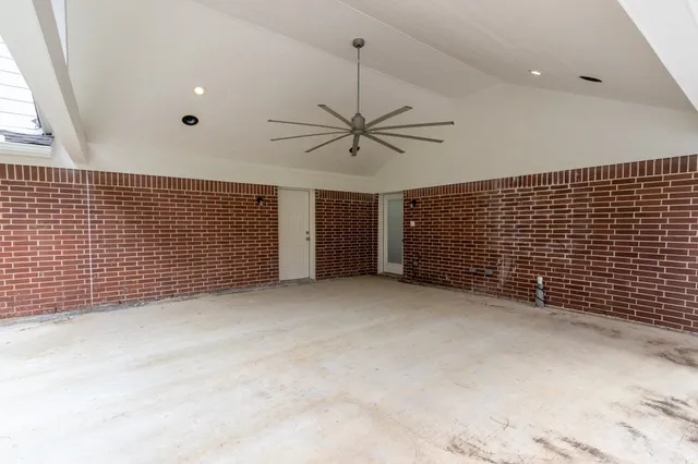 a view of a livingroom with a ceiling fan and window