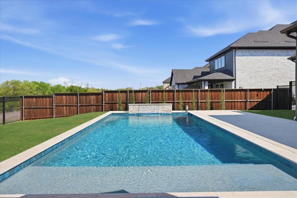 2721 Rotherham Street Prosper, TX 75078 - Photo 36 of 37 a view of a backyard with a garden and deck