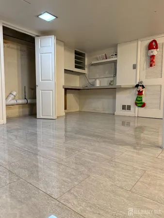 a view of kitchen with furniture and wooden floor