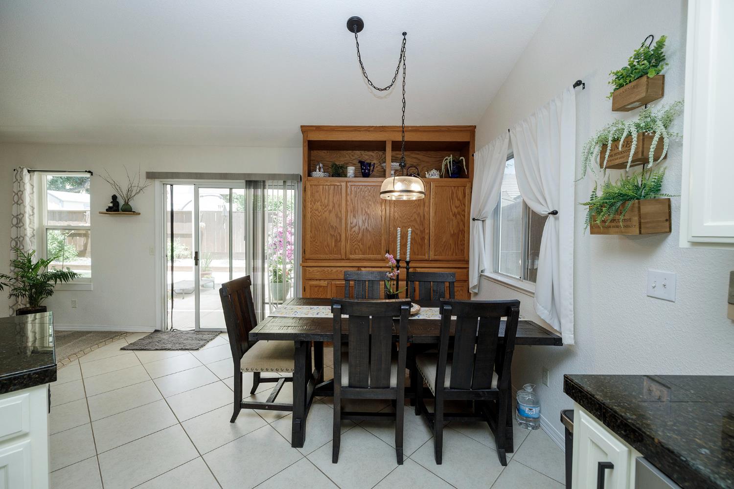230 Meyenberg Avenue Ripon, CA 95366 - Photo 23 of 52 a dining room with furniture and window