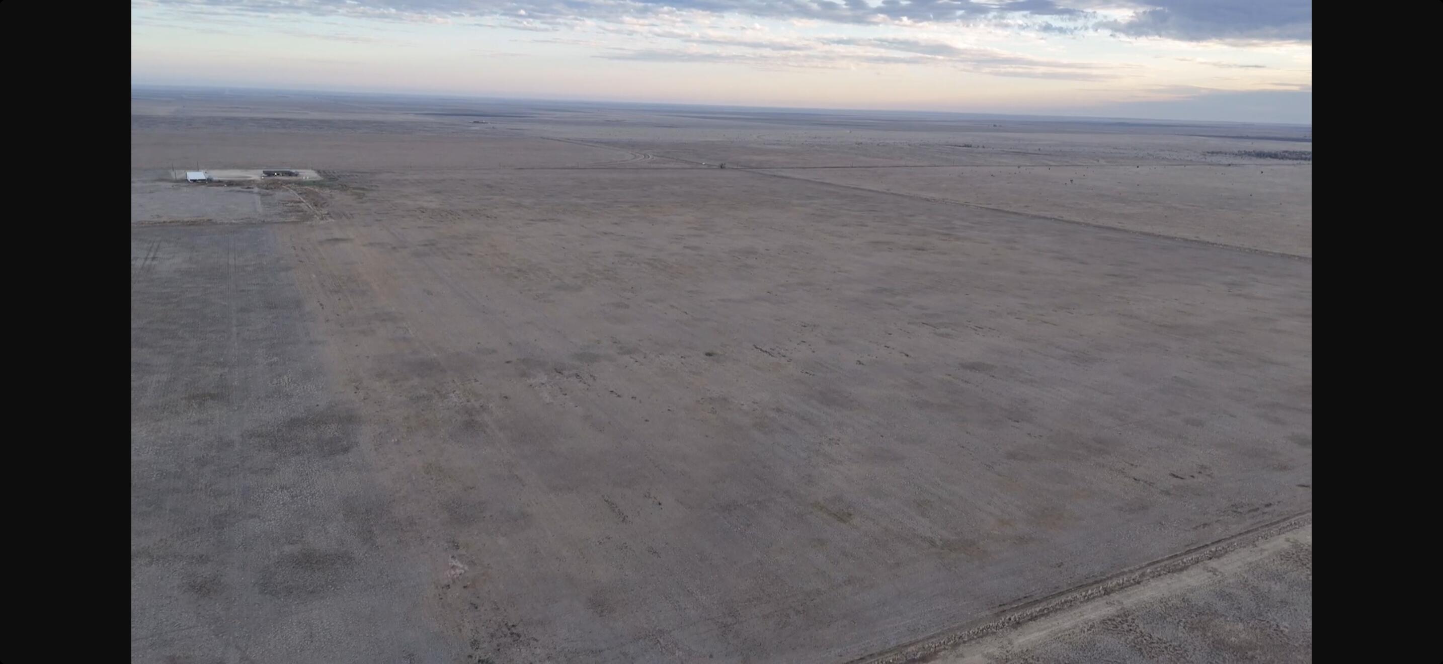 a view of city next to a yard