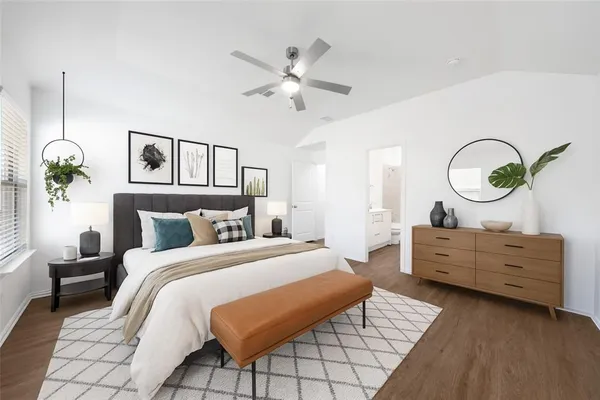a bed room with a bed mirror and a window