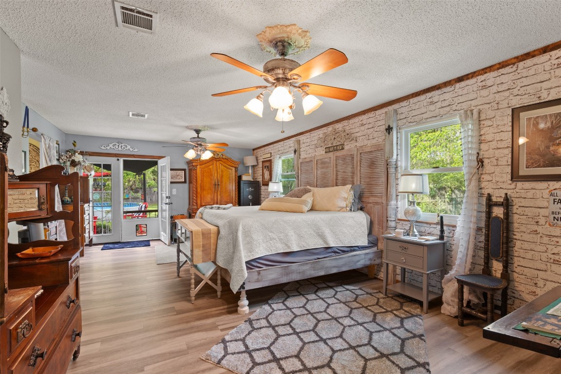 10960 McDowell Road Conroe, TX 77306 - Photo 15 of 25 Extremely spacious primary retreat with character accents and private outdoor access.