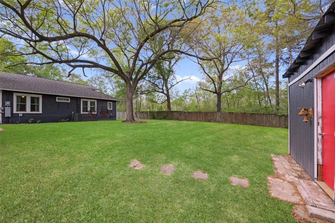 10960 McDowell Road Conroe, TX 77306 - Photo 25 of 25 Private, park-like setting with shaded lawn and serene surroundings. Amazing trees.
