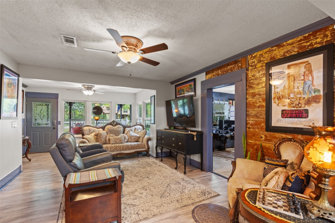 10960 McDowell Road Conroe, TX 77306 - Photo 4 of 25 Comfortable living space filled with natural light and cozy charm. Enjoy the new Anderson Windows throughout the house.