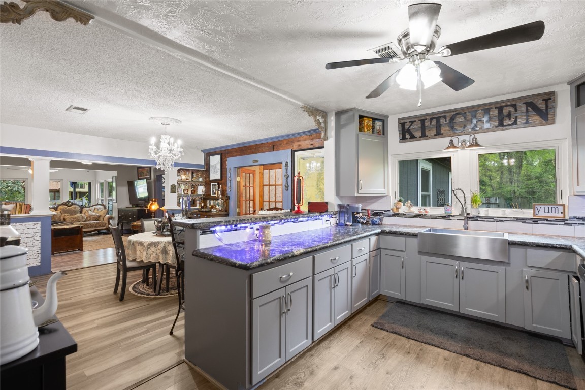 10960 McDowell Road Conroe, TX 77306 - Photo 9 of 25 Spacious layout with farmhouse sink, modern finishes, and functional workspace.