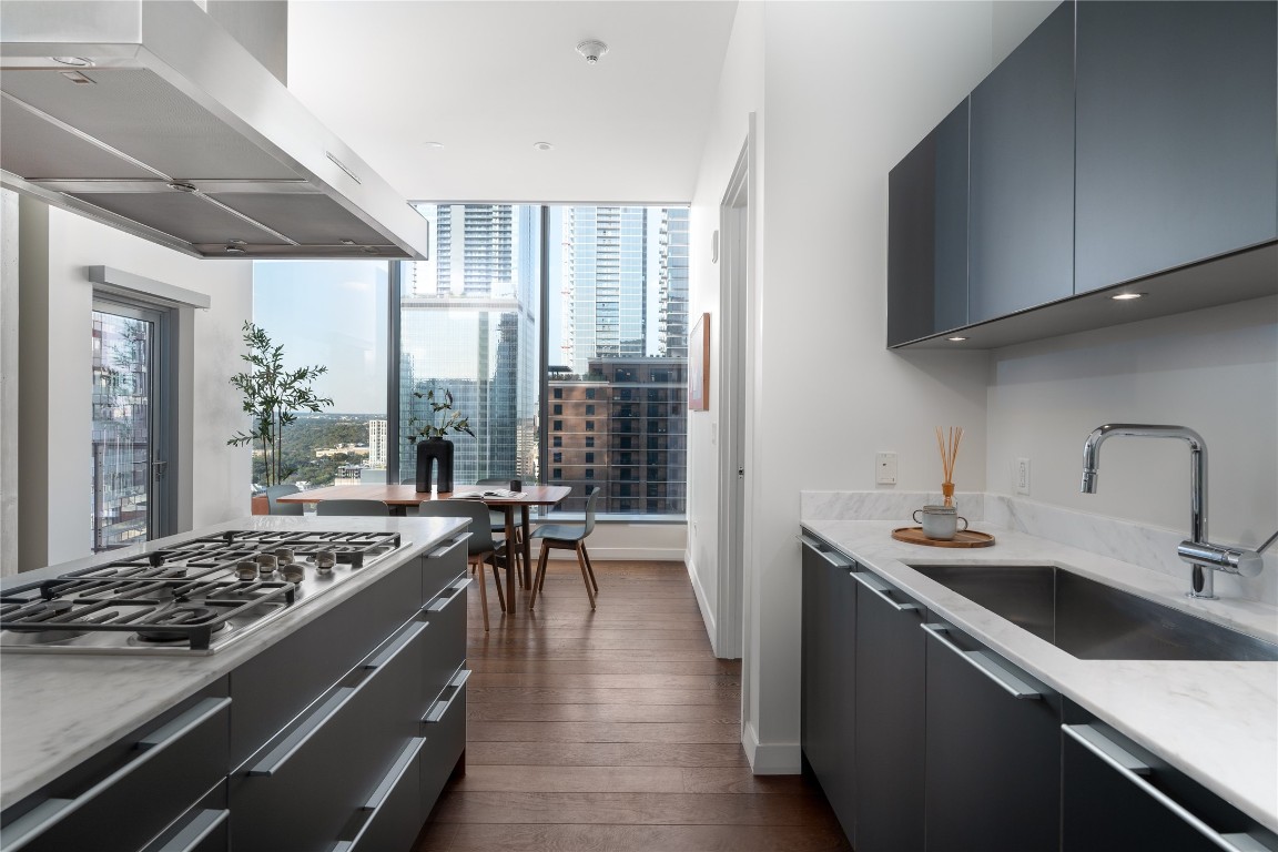 210 Lavaca Street, Unit 2211 Austin, TX 78701 - Photo 1 of 1 a kitchen with a stove and a sink