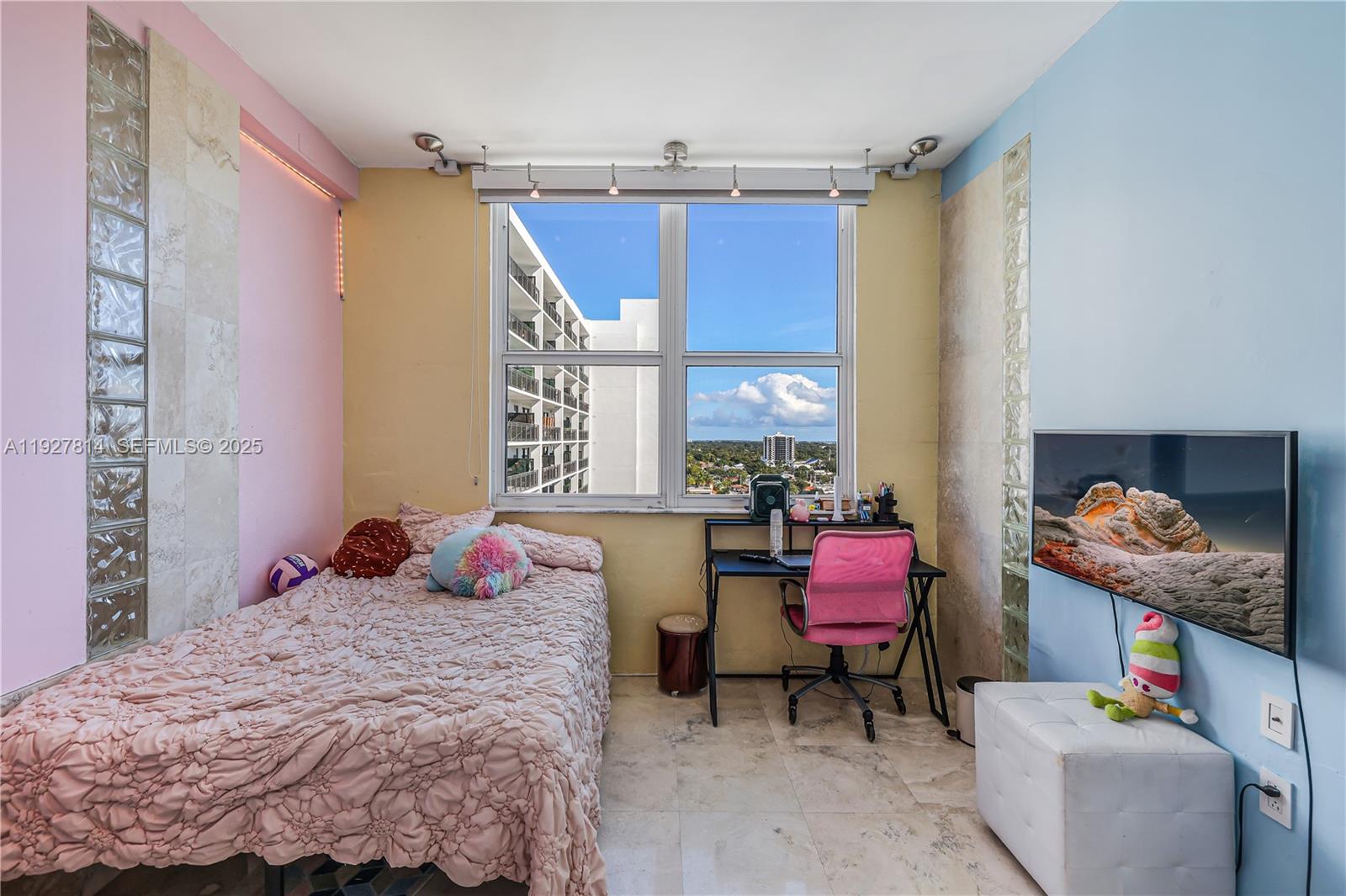 3180 Southwest 22nd Terrace, Unit PH201 Miami, FL 33145 - Photo 38 of 58 a bedroom with a bed and large windows