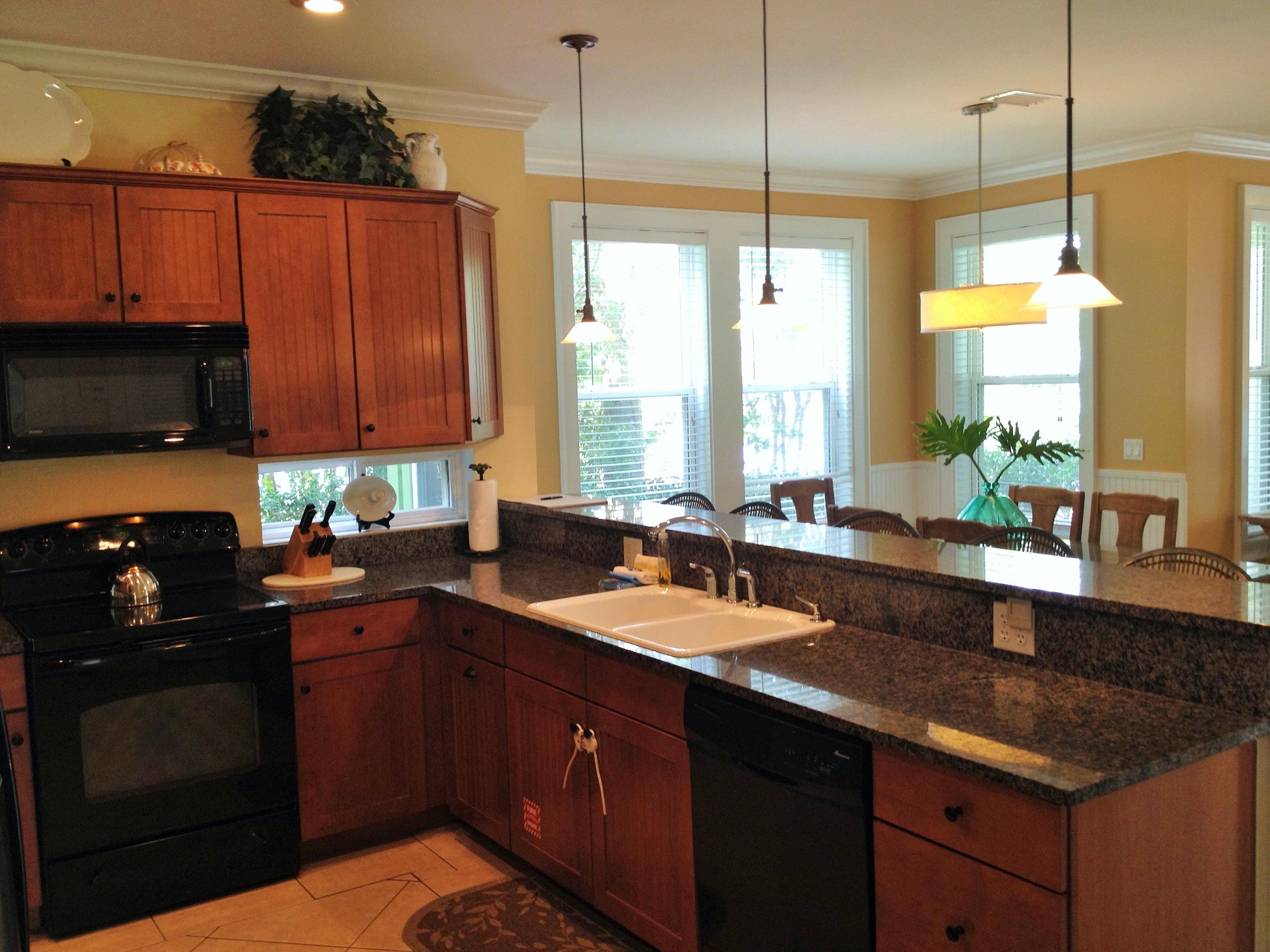 89 West Blue Crab Loop Inlet Beach Inlet Beach, FL 32461 - Photo 11 of 42 a kitchen with a sink stove and microwave
