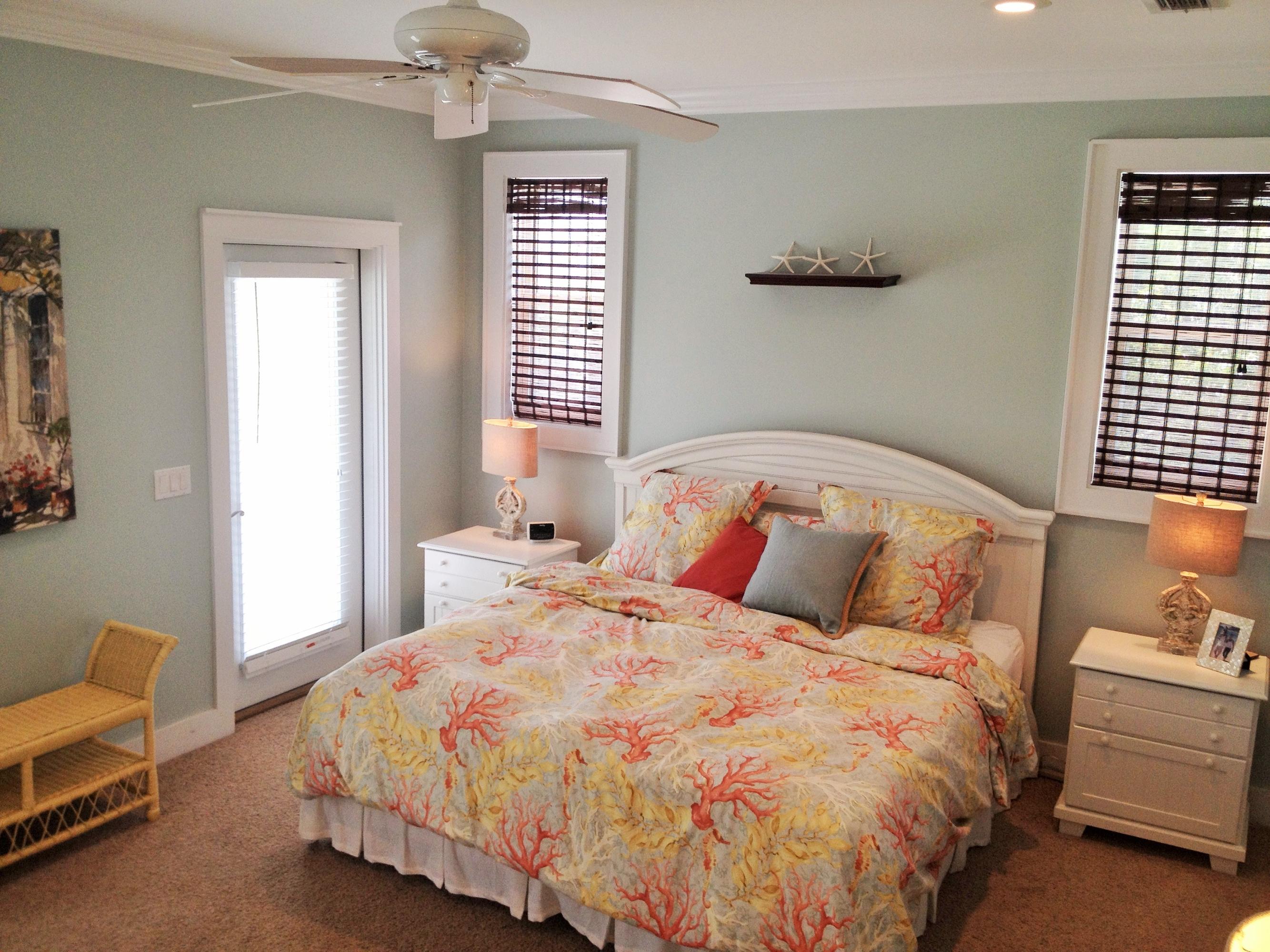 89 West Blue Crab Loop Inlet Beach Inlet Beach, FL 32461 - Photo 25 of 42 a large bed sitting in a bedroom next to a window and a chandelier