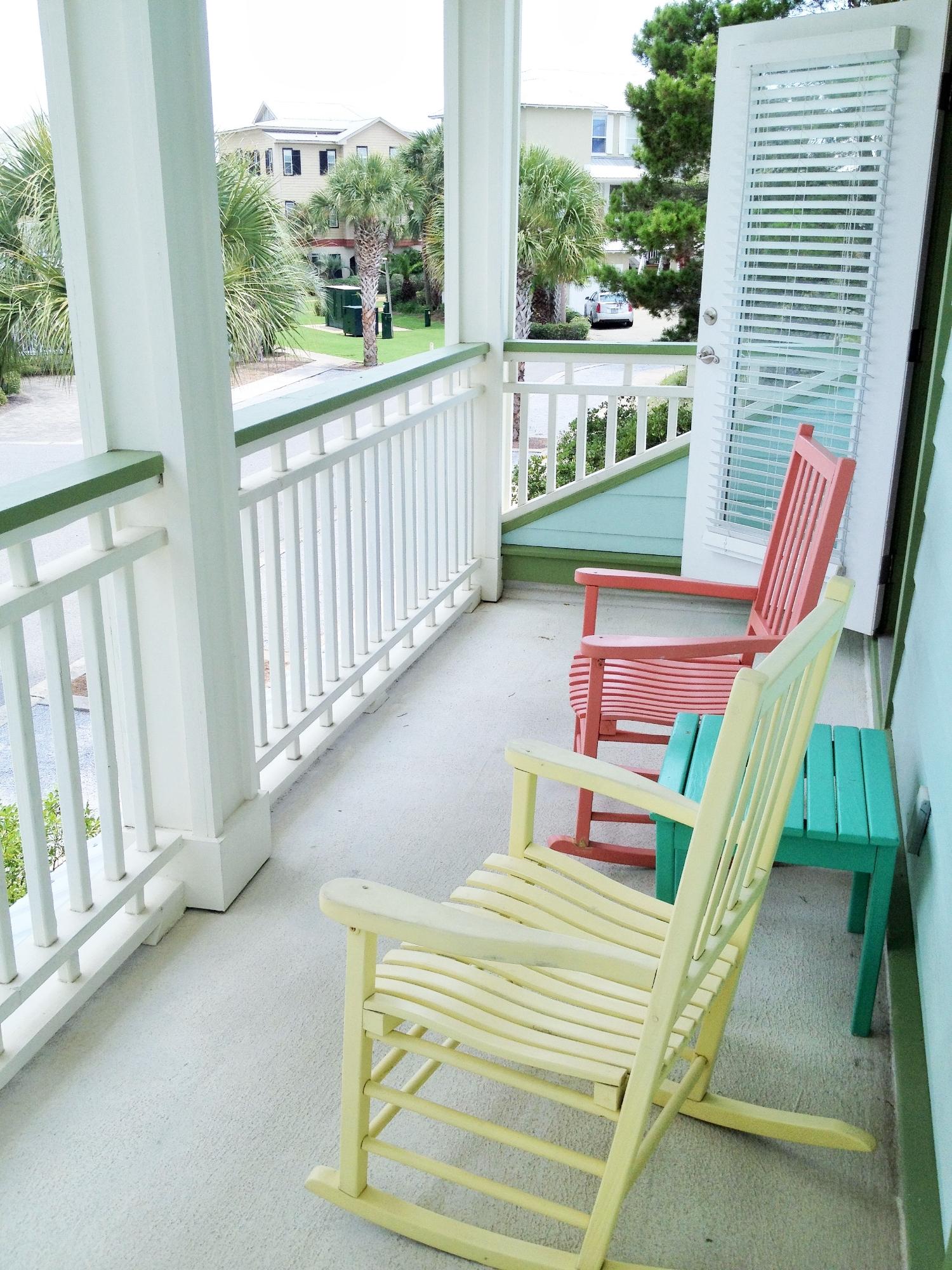 89 West Blue Crab Loop Inlet Beach Inlet Beach, FL 32461 - Photo 26 of 42 a balcony with furniture and garden view