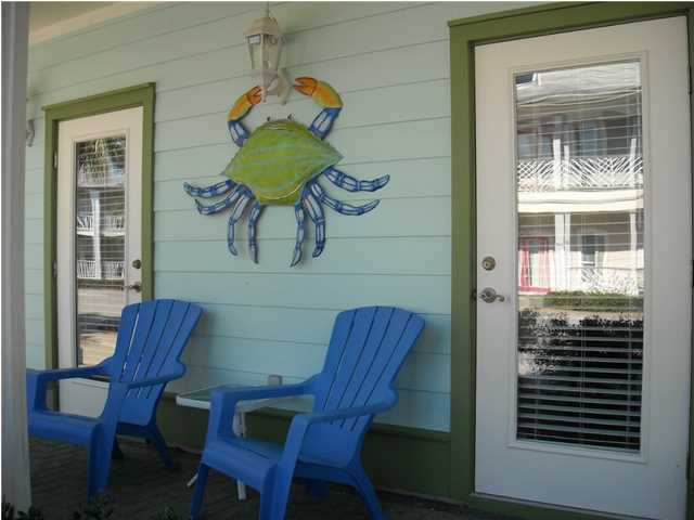 89 West Blue Crab Loop Inlet Beach Inlet Beach, FL 32461 - Photo 3 of 42 a view of dining room and livingroom with furniture wooden floor a rug and a window
