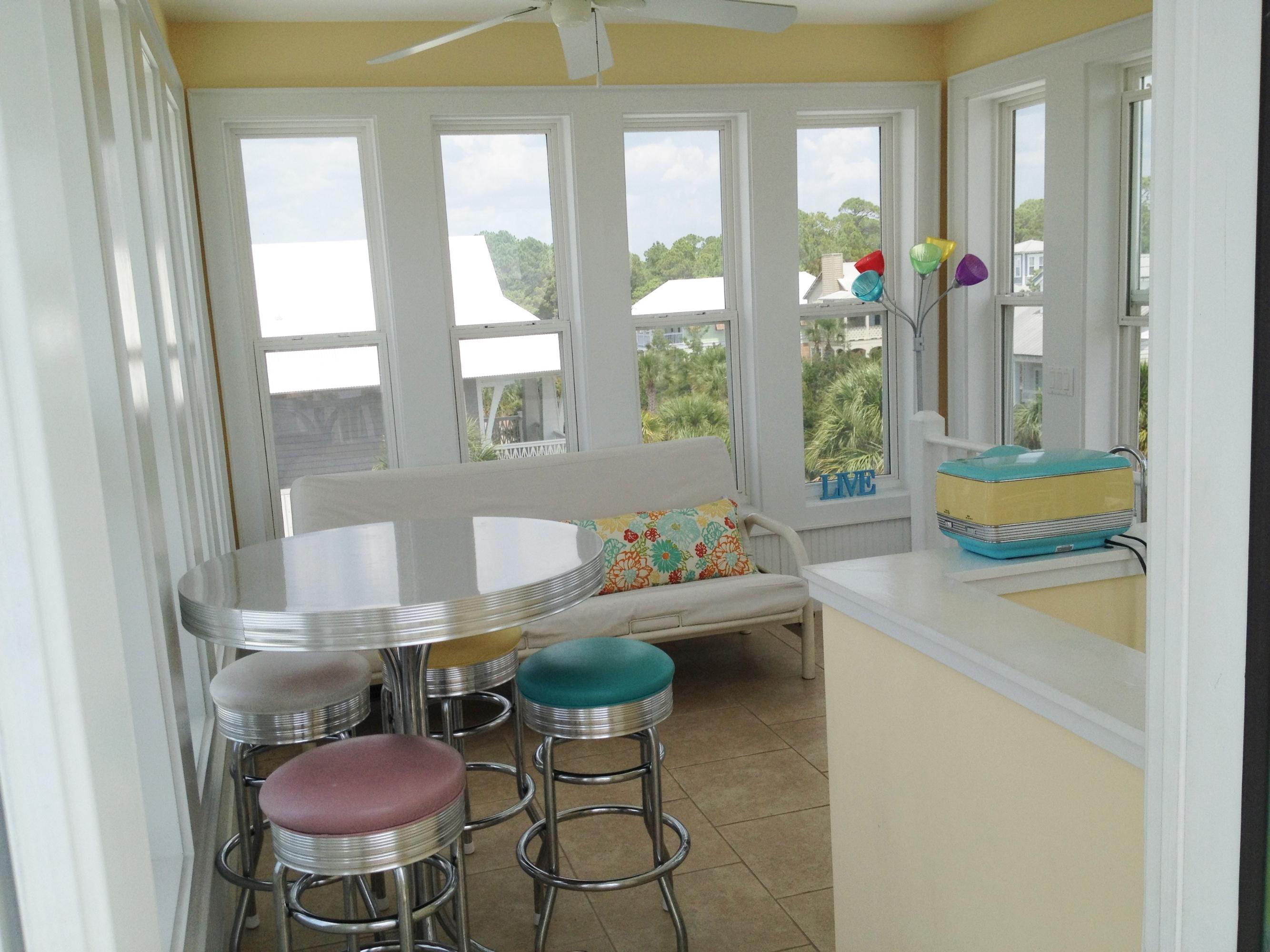 89 West Blue Crab Loop Inlet Beach Inlet Beach, FL 32461 - Photo 31 of 42 a room that has a lot of furniture and a window