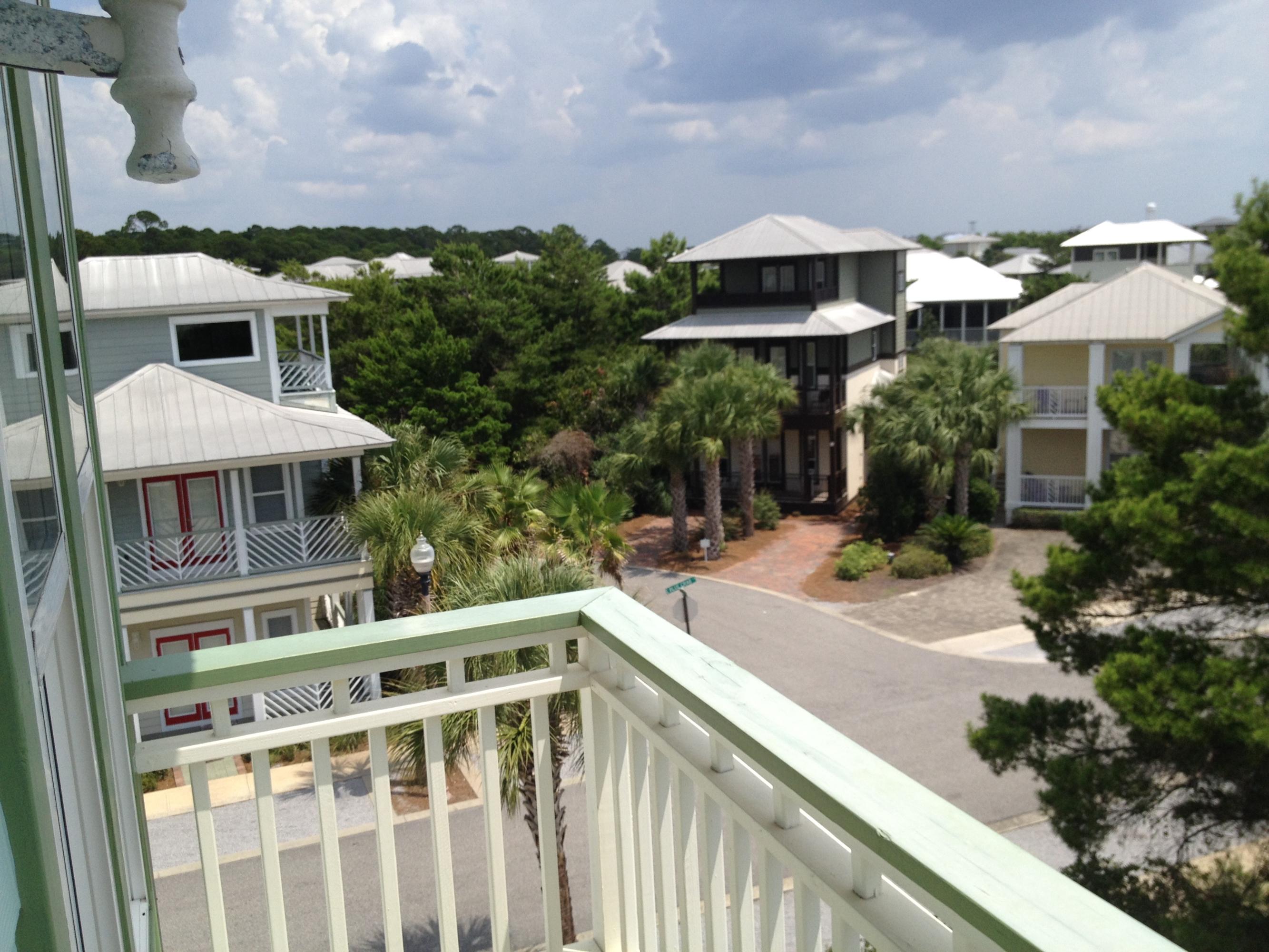 89 West Blue Crab Loop Inlet Beach Inlet Beach, FL 32461 - Photo 32 of 42 a balcony with table and chairs