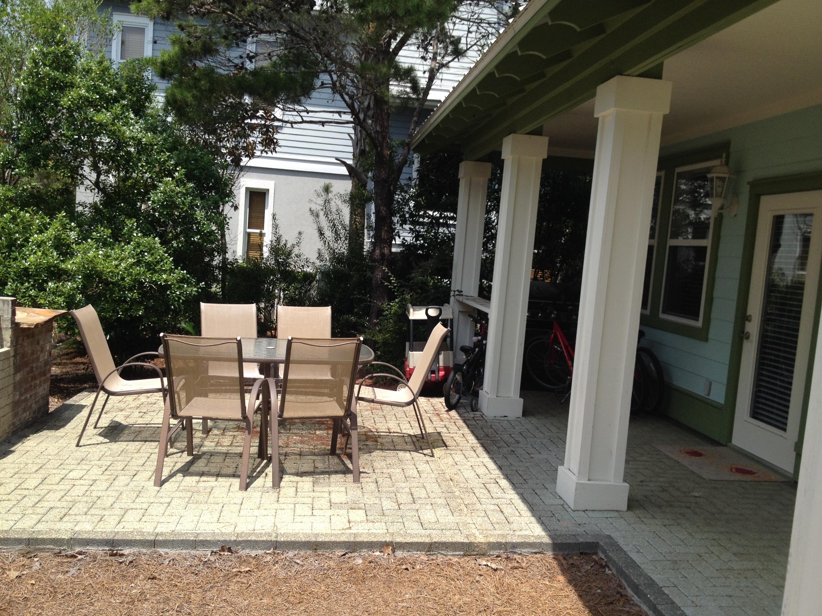 89 West Blue Crab Loop Inlet Beach Inlet Beach, FL 32461 - Photo 8 of 42 a view of a patio with table and chairs and potted plants