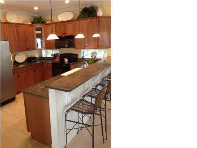 89 West Blue Crab Loop Inlet Beach Inlet Beach, FL 32461 - Photo 10 of 42 a kitchen with stainless steel appliances granite countertop a sink and cabinets