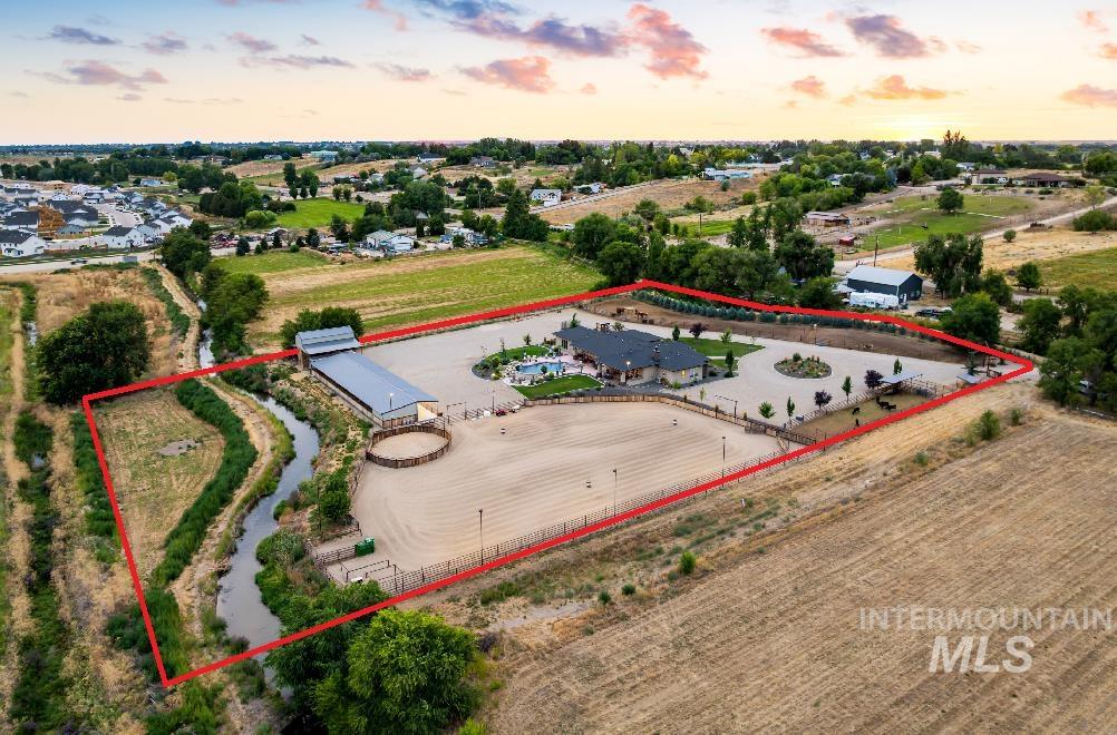 9819 Foothill Road Middleton, ID 83644 - Photo 8 of 49 Aerial view at dusk of property boundaries highlighted and a view of countryside