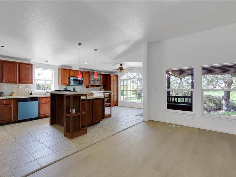 3974 South Meridian Road Meridian, CA 95957 - Photo 6 of 75 a large kitchen with stainless steel appliances granite countertop a stove and cabinets