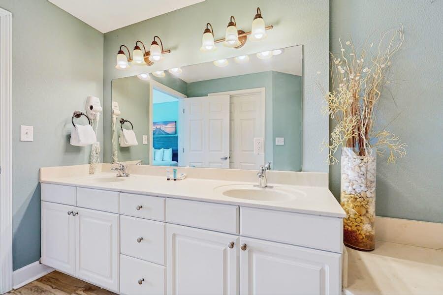 16819 Front Beach Road, Unit 602 Panama City Beach, FL 32413 - Photo 14 of 53 a bathroom with a double vanity sink mirror and