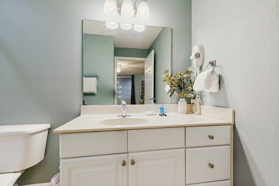 16819 Front Beach Road, Unit 602 Panama City Beach, FL 32413 - Photo 17 of 53 a bathroom with a sink and a mirror