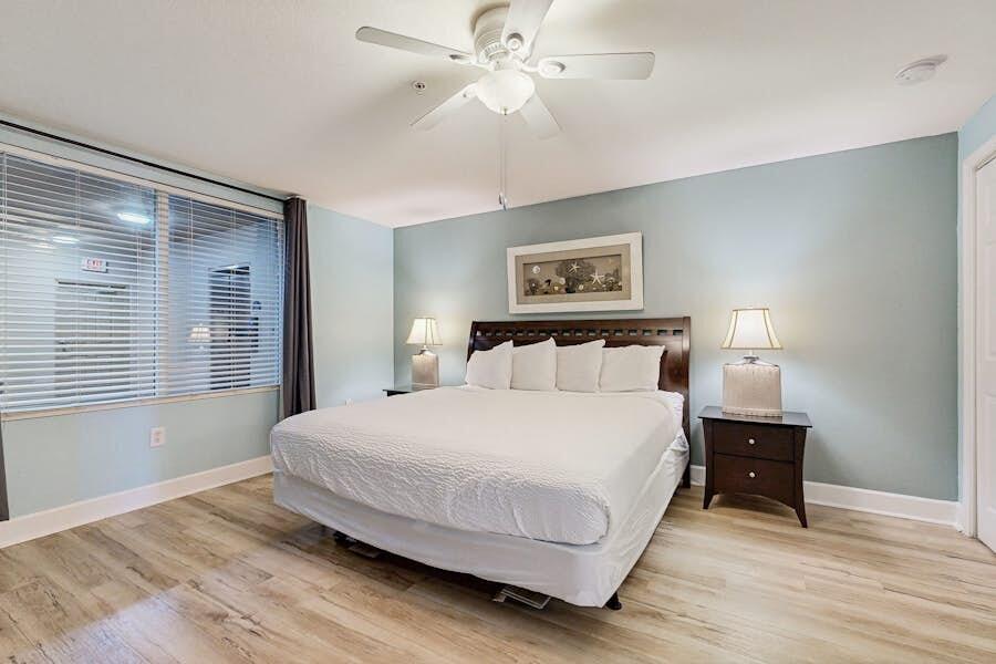 16819 Front Beach Road, Unit 602 Panama City Beach, FL 32413 - Photo 18 of 53 a bedroom with a bed and a window