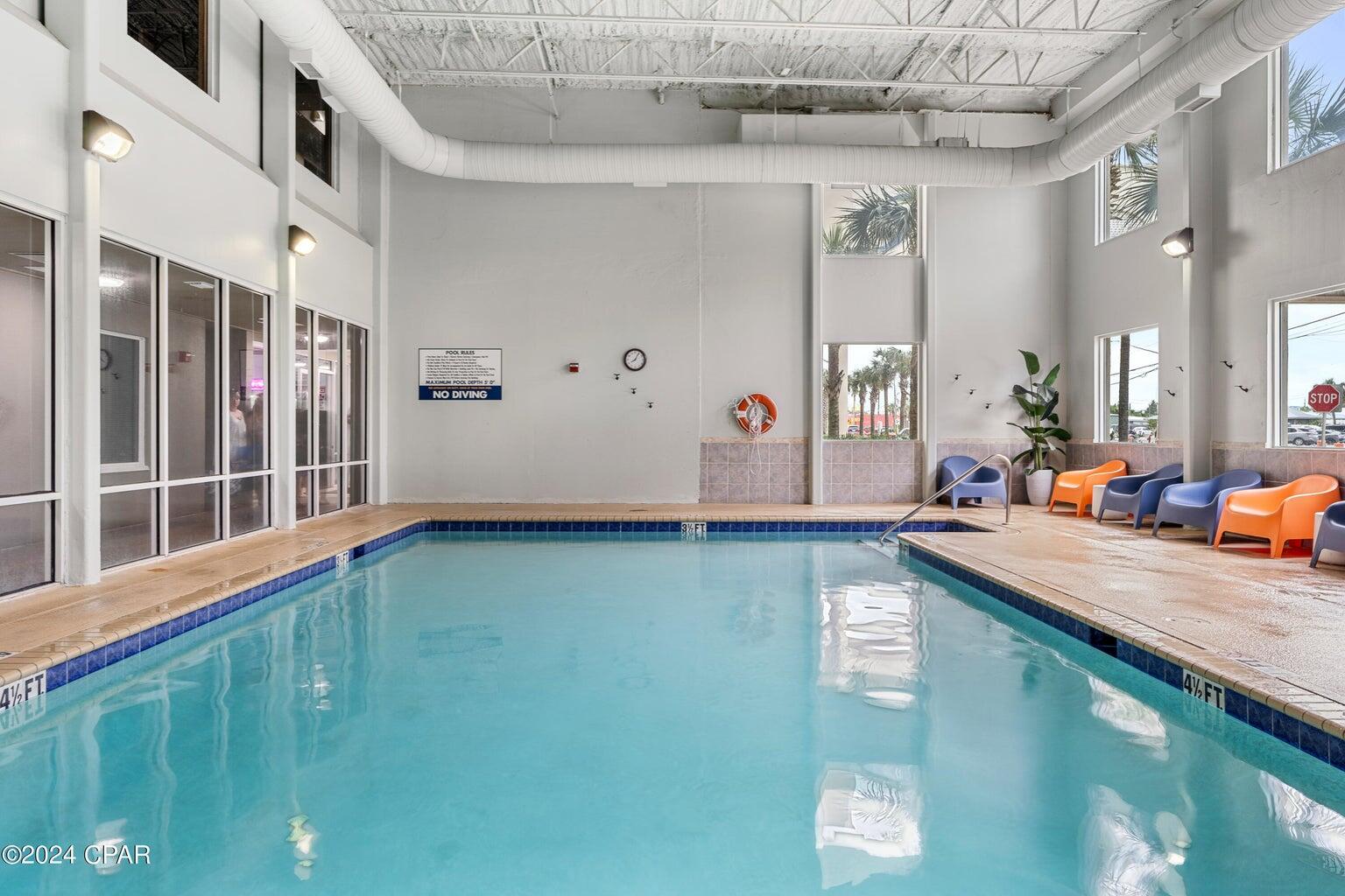 16819 Front Beach Road, Unit 602 Panama City Beach, FL 32413 - Photo 24 of 53 a view of a kitchen with a sink washer and dryer